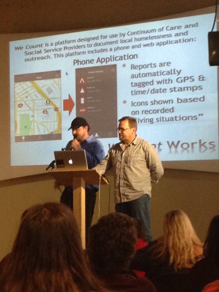 Graham Pruss and Jeff Lilley demo their app for surveying the needs of people living on the streets.