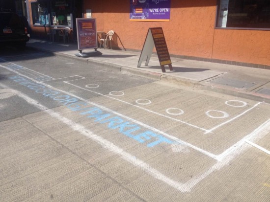 Future U District Parklet site spray painted on the ground.