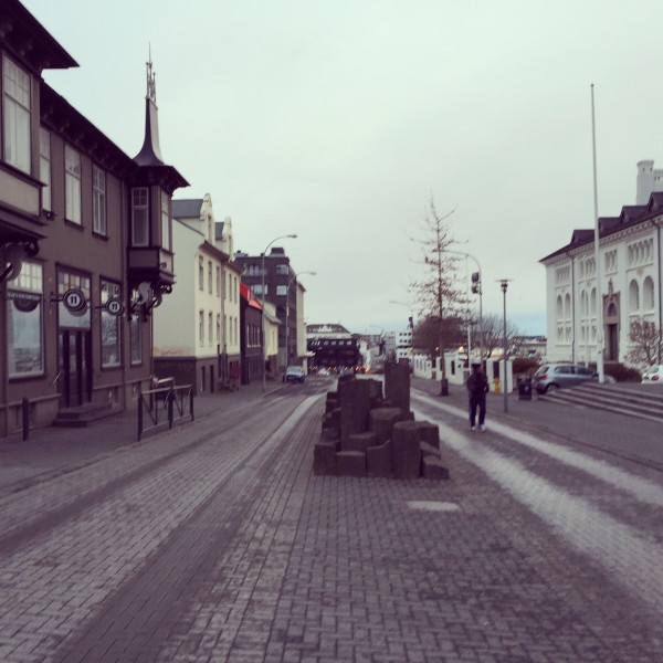 Woonerf street with a median street furniture, doubles as an extended plaza.