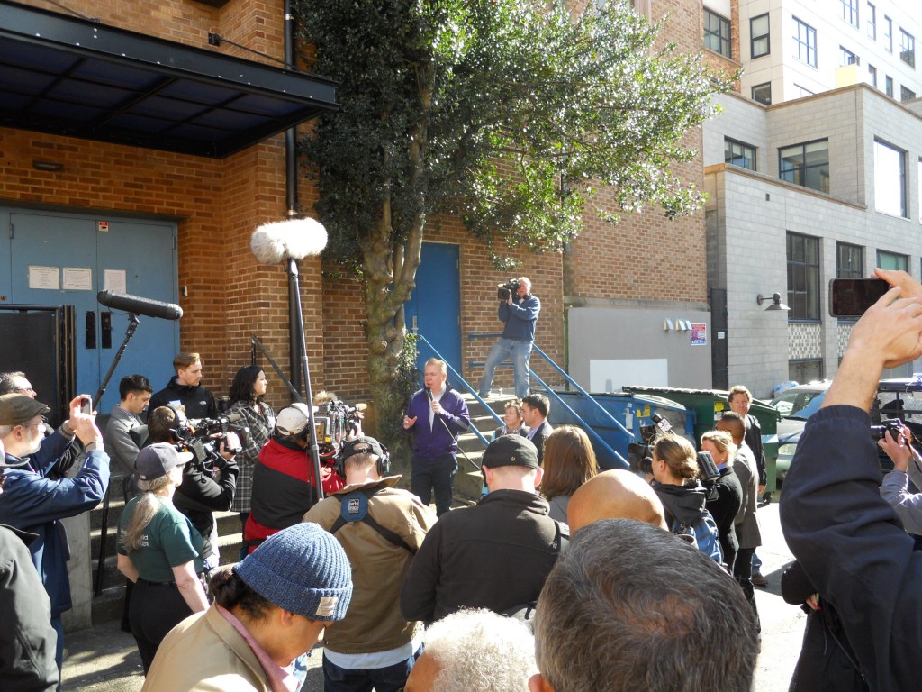 Media crowding the Mayor.