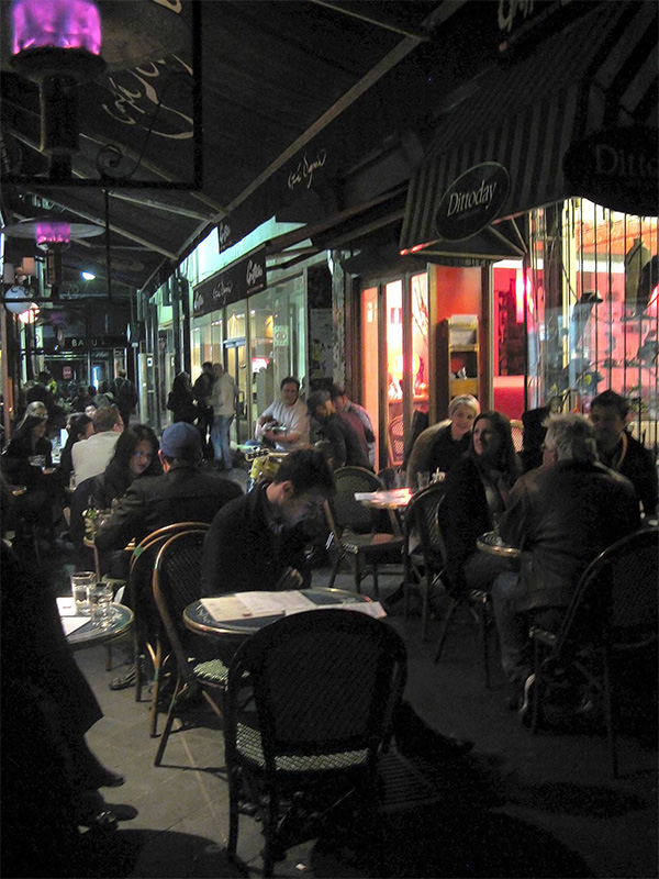 Into the evening, Block Place in Melbourne, is bustling with people sitting at one of the cafes spilling into the laneway, with musicians enhancing the ambience. 