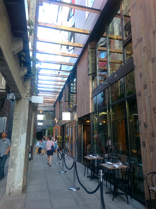 The Chophouse Row development in Capitol Hill, Seattle provides a new alley connection with cafes and restaurants activating the space at different times of day. Photo by Sarah Oberklaid. 