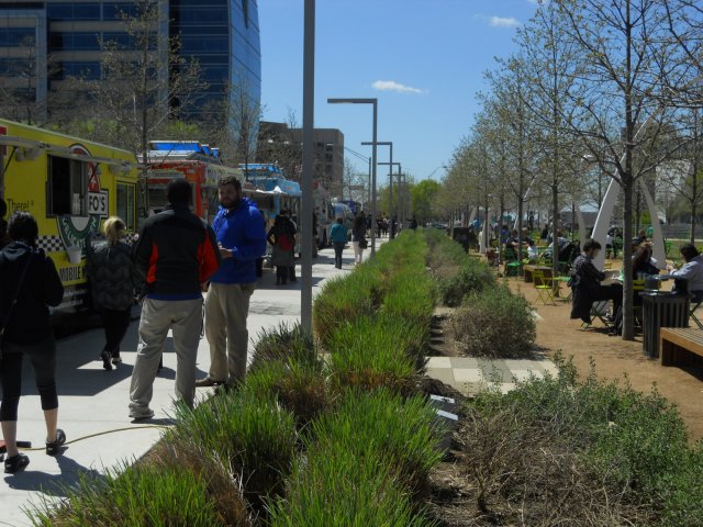 Klyde Warren's Park's street edges are activated with food trucks, clear sight lines, and flexible seating. (Photo by the author)