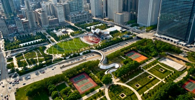 Though completed four years late and $325 million over budget, Chicago's Millenium Park is an excellent example of a modern urban park in a major downtown with things to see, hear, feel, and do. It's also essentially a giant lid; its 24 acre surface is 45 feet above a cavern of rail yards, parking garages, and transit tunnels. (Chicago Genie)