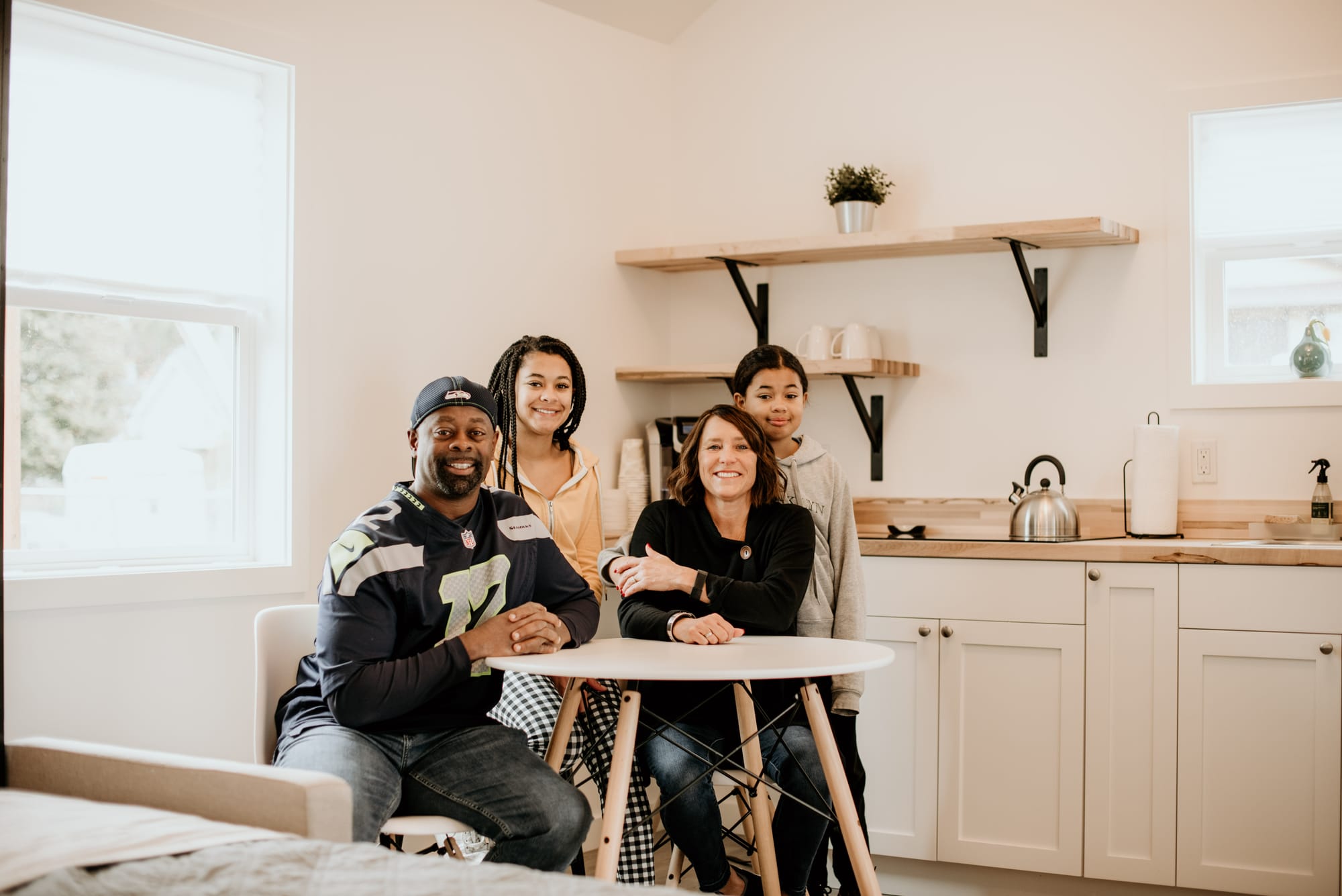 The Cunningham family inside their new backyard cottage. Credit: MyKabin