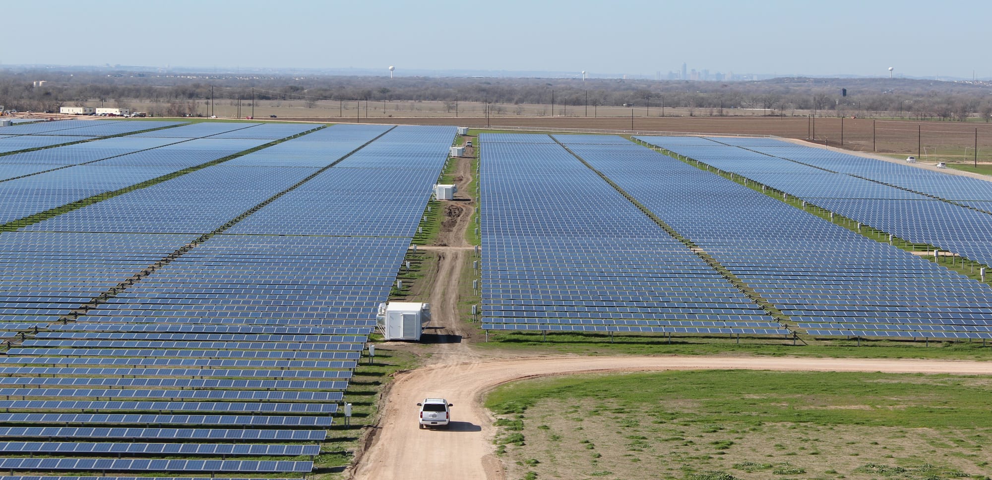 The Webberville Solar Farm spreads out over a flat plain near Austin.