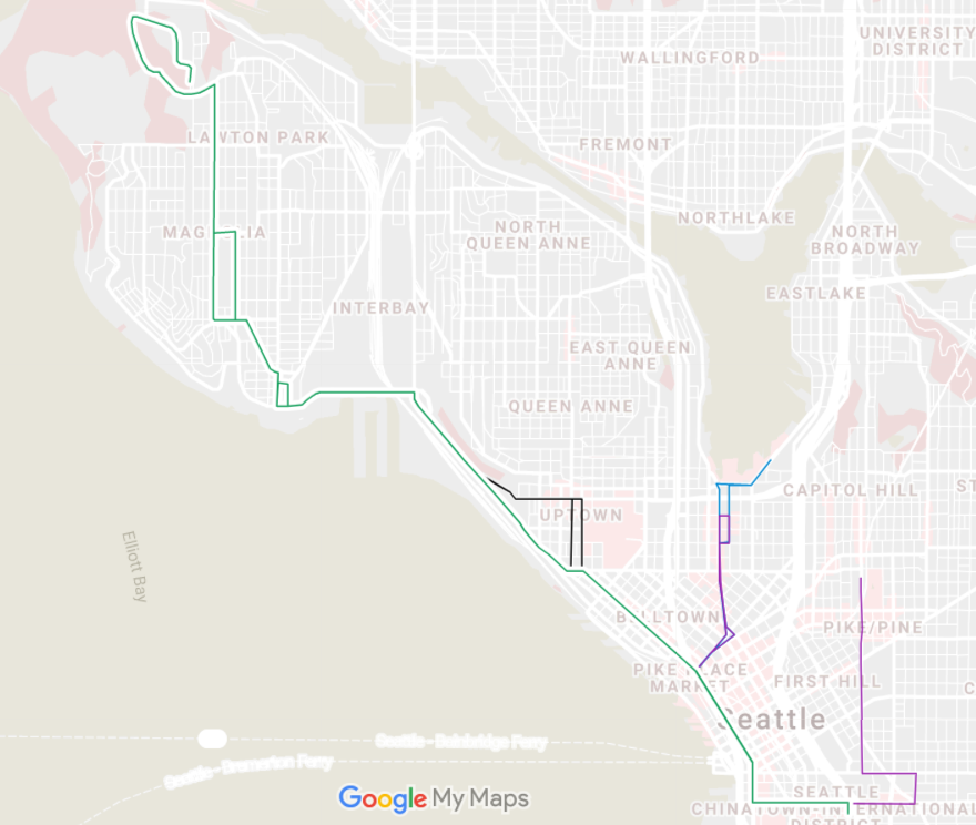 A map of the north end of Downtown Seattle shows a streetcar line extending north through Interbay into Magnolia. 