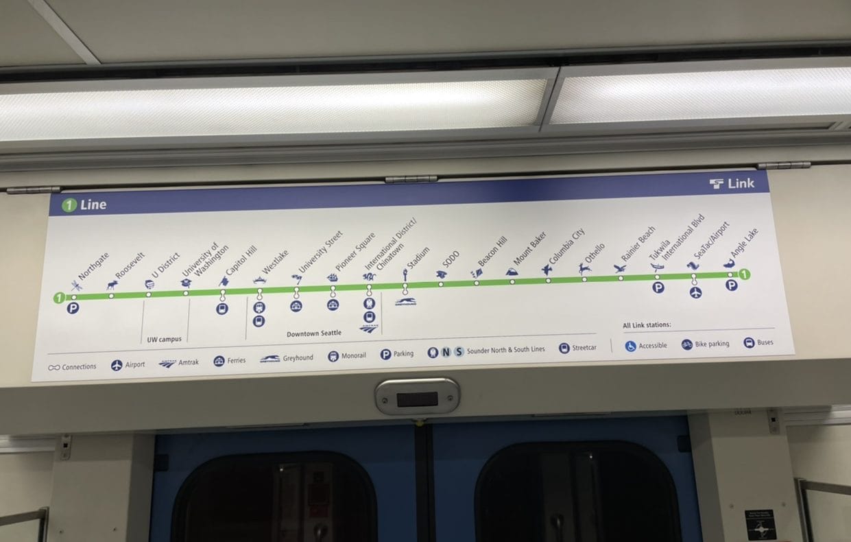 A station line diagram above a Link light rail door shows the existing name for University Street Station, but Downtown Seattle is indicated below to add a bit of clarity.