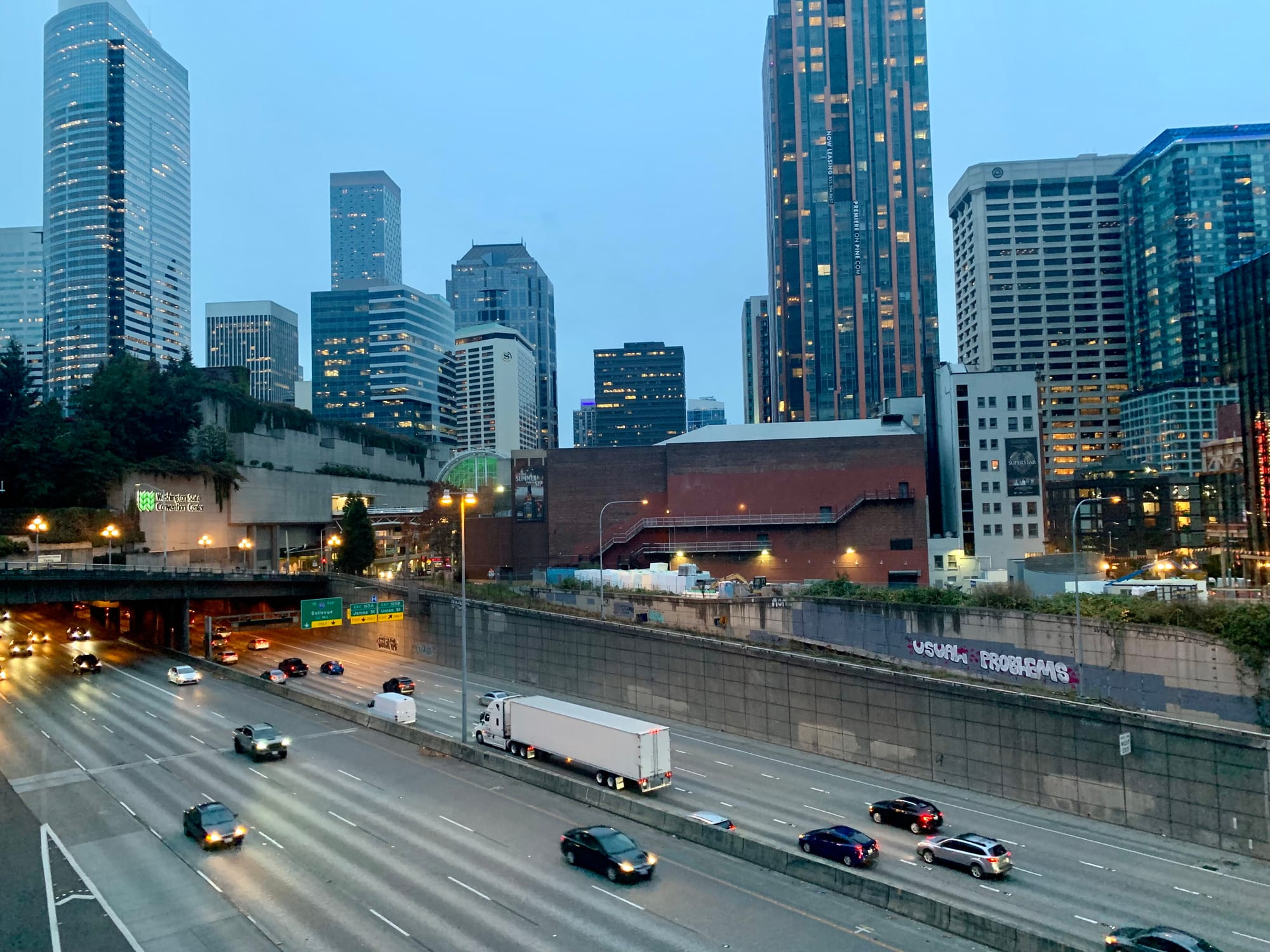 A photo shows the I-5 freeway in Downtown Seattle near the Washington State Convention Center.