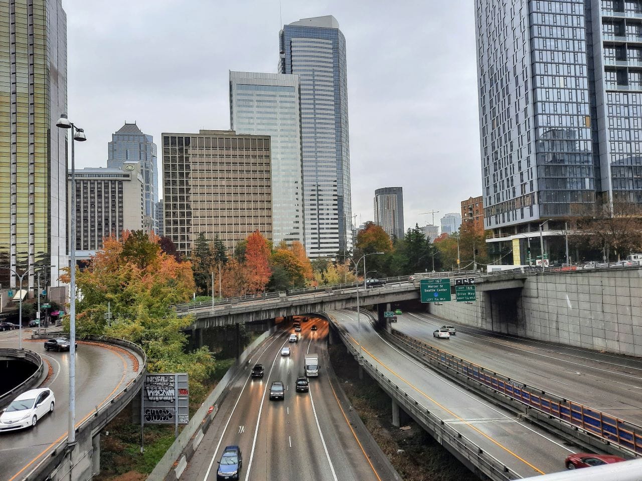
                     I-t trench with skyscapers and overpasses in the background.
                     