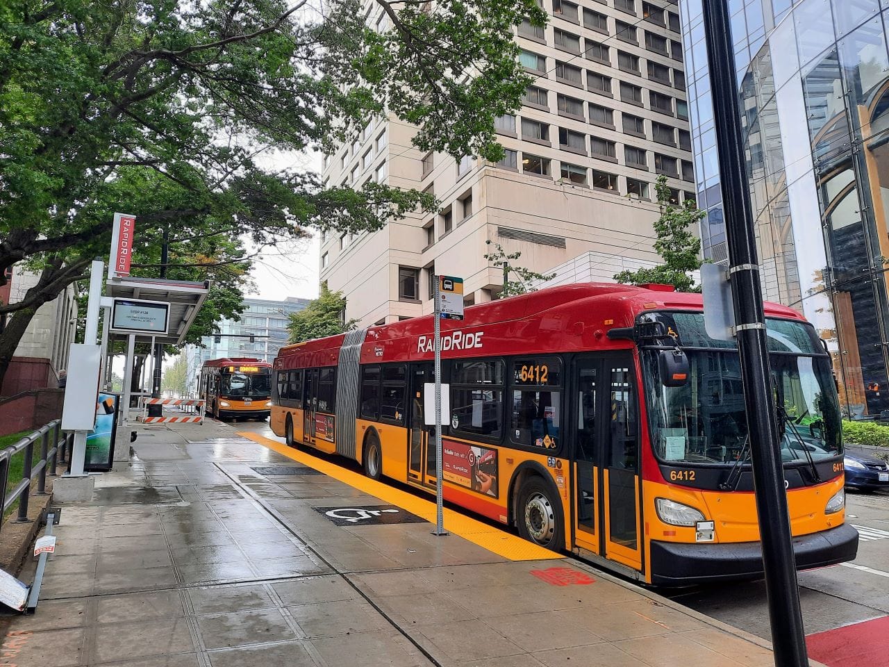 The G Line sports King County Metro's red and gold livery.