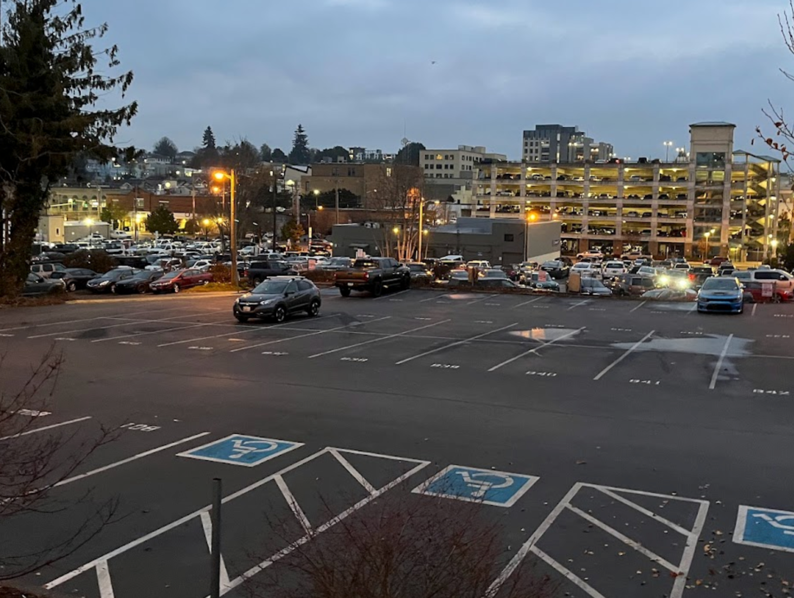 A parking lot next to a five story parking garage in central Bremerton.