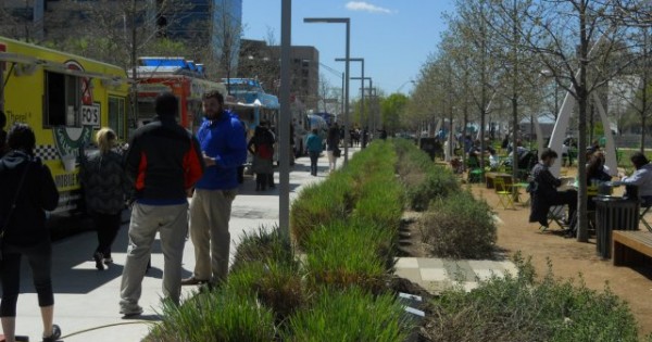Klyde Warren's Park's street edges are activated with food trucks, clear sight lines, and flexible seating. (Photo by the author)