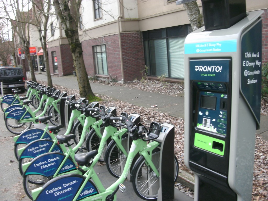 Bikeshare station taking up two parking spaces with only one empty stall