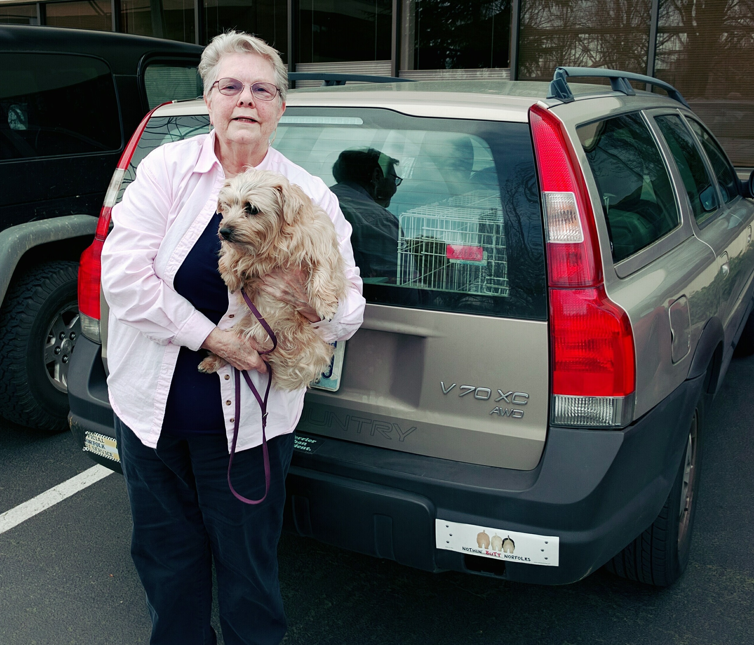 Sandy with Abbey and her Volvo.