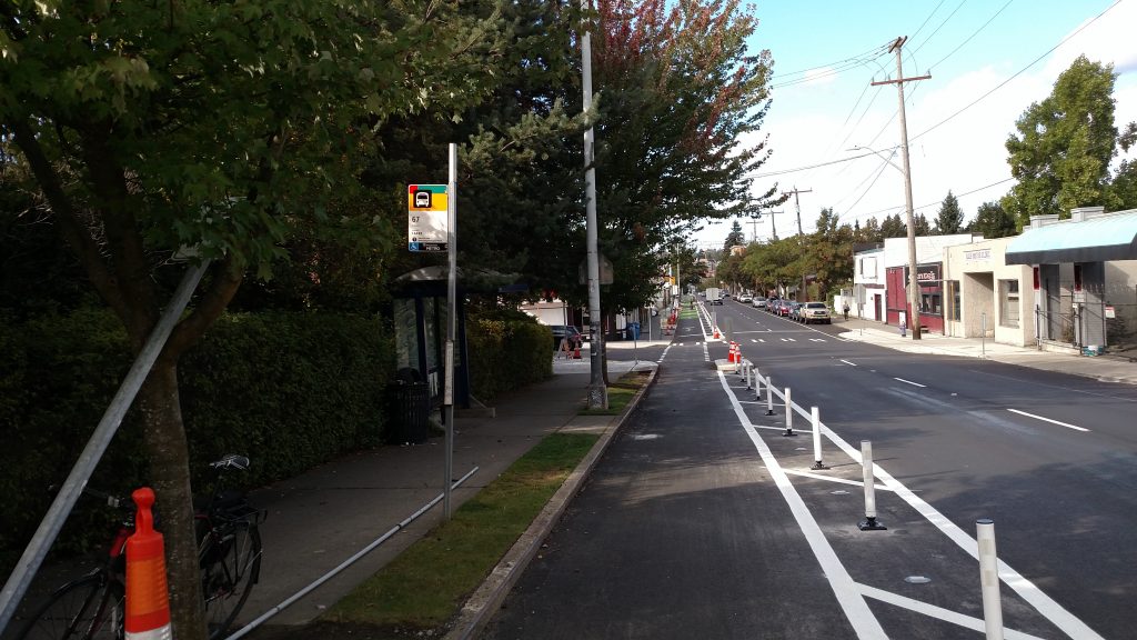 Decommissioned bus stop on the left, curb extension on the right.