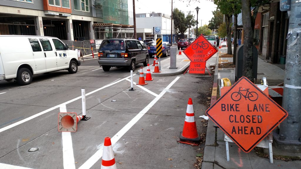 Future bus island with bike lane between the curb and island.