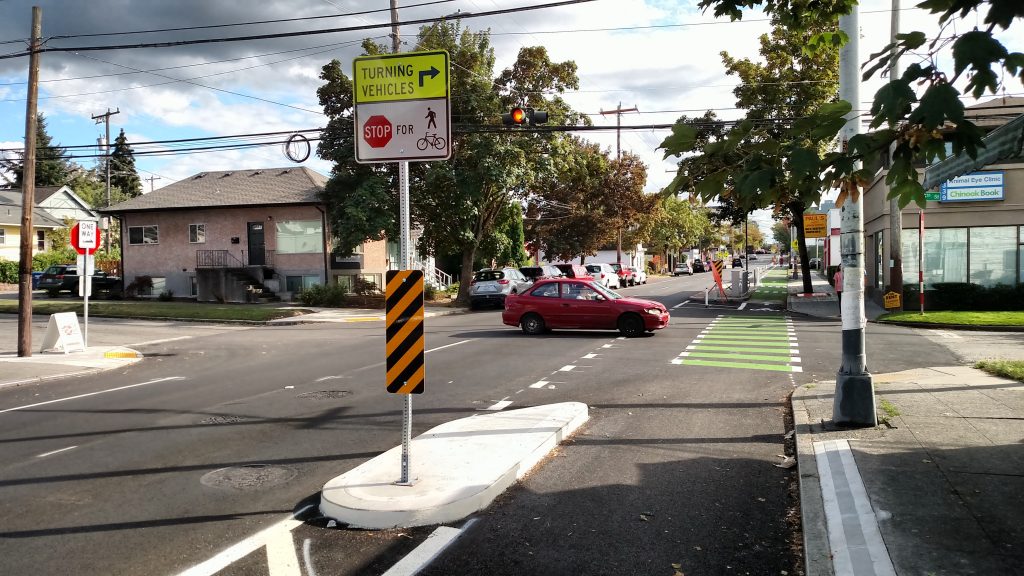 A diverter island near an intersection to give separation and protection for bikes from right turning motorized vehicles.