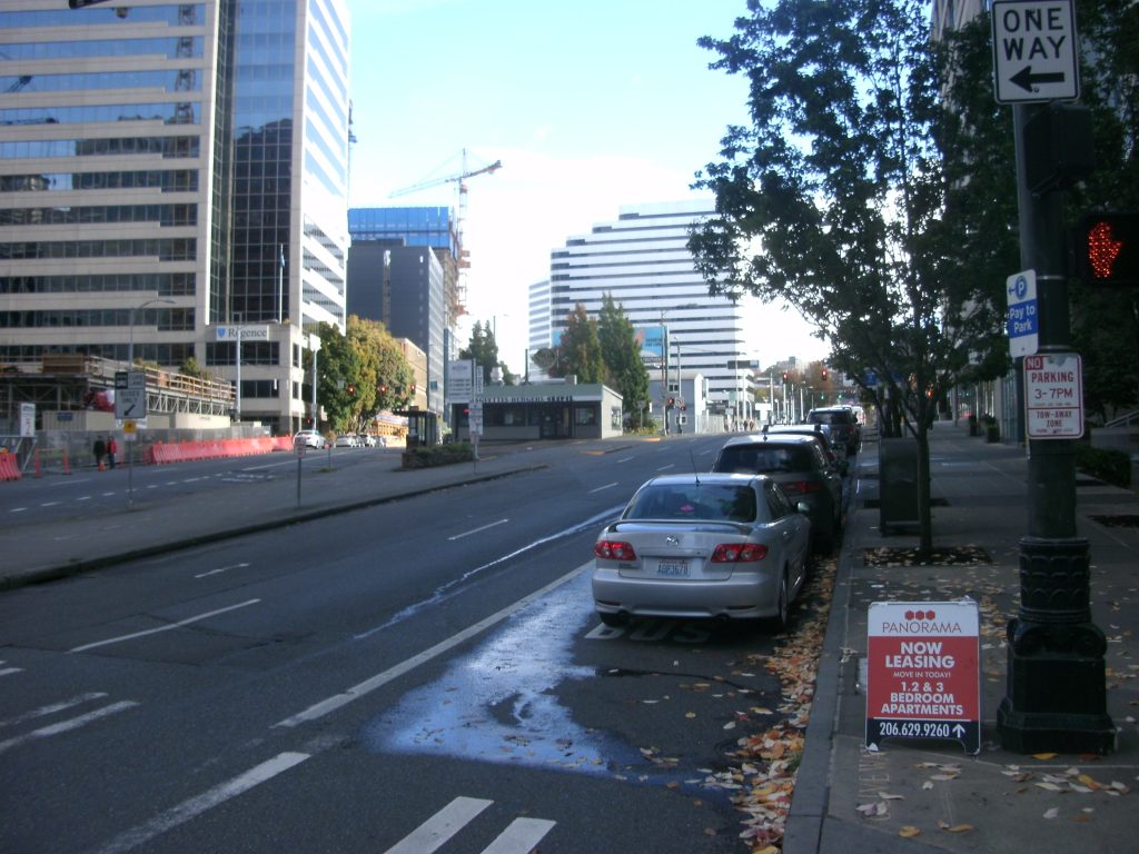 Cars parked in bus lane during off-peak.