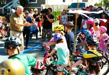 Mayoral Challengers Face Uphill Battle To Satisfy Market Urbanists Mayor Mike McGinn cutting the ribbon on the Ballard Neighborhood Greenway as kids on bikes line up to get a first ride. (Credit: Dennis Bratland)
