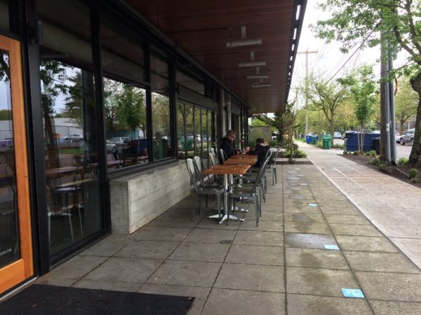 Feed Co. Burgers with a fence-free sidewalk café in the Central District. (City of Seattle)