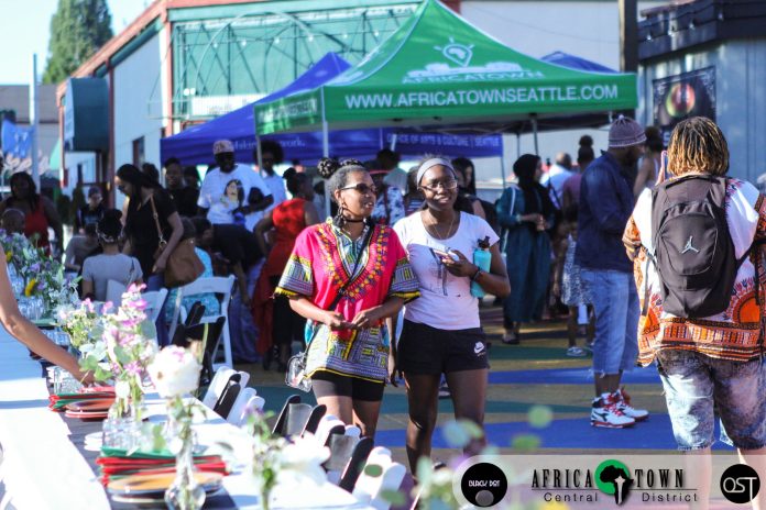 Dinner Scene with Africatown Sign