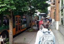 Judge Grants I-976 Injunction, Pausing Transit Cuts A long line of riders wait to board a Route 8 bus at Denny and Westlake. (Photo by Doug Trumm)