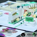 Model with Africatown Sign