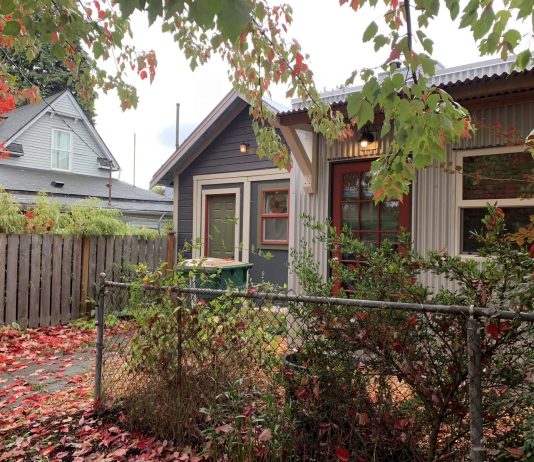 Seattle’s Backyard Cottage Plan Falls Short A cottage in a leafy backyard in the fall.