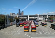 Transit Agencies Step Up Sanitation Efforts and Issue Guidance for Preventing Spread of Novel Coronavirus Rows of buses with the I-90 ramps and Seattle skyscrapers in the background.