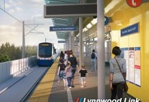 Lynnwood Link Finally Secures $1.17 Billion from the FTA, Clearing Path to Open in 2024 A rendering show passenger waited on a platform at an elevated station as a light rail train pulls in.