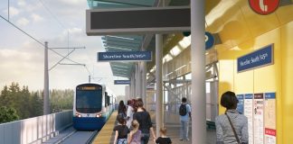 A rendering show passenger waited on a platform at an elevated station as a light rail train pulls in.