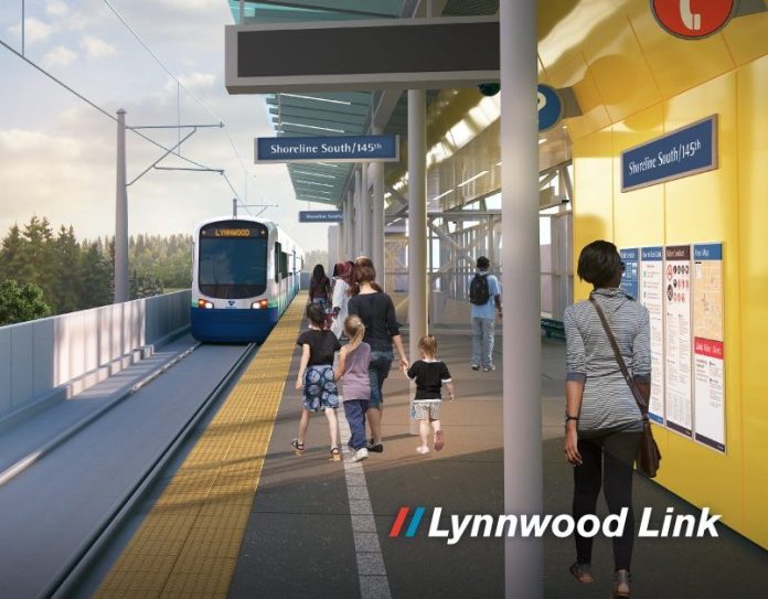 A rendering show passenger waited on a platform at an elevated station as a light rail train pulls in.