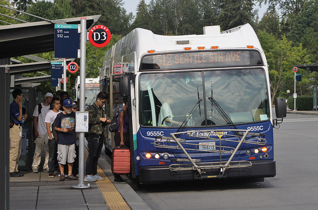 Commuters in Lynnwood wait in line before boarding. (Bruce Englehardt)