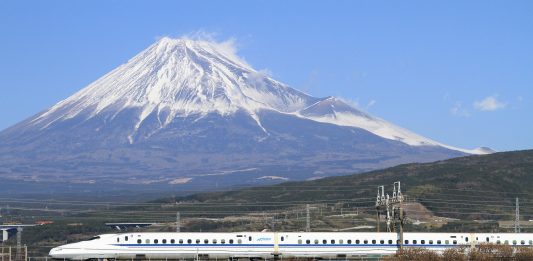 The Tōkaidō Shinkansen high-speed line in Japan, with Mount Fuji in the background. The Tokaido Shinkansen was the world's first high-speed rail line. (Wikipedia / tansaisuketti)