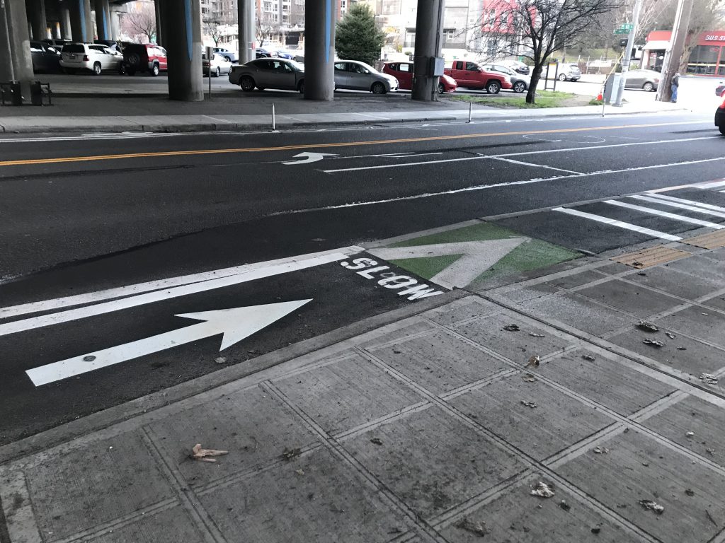 New bike lane and in-lane bus stop curb extension. 