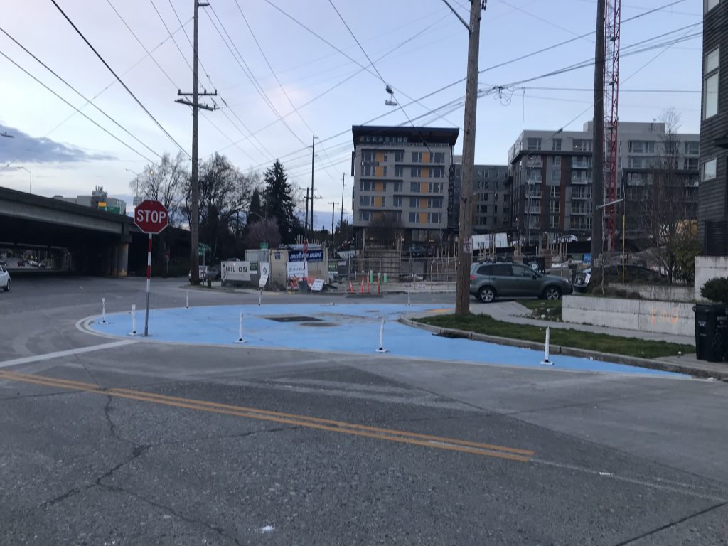 Weedin Pl NE painted curb bulb at NE 66th St.