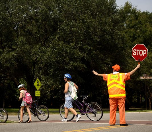 Council Takes Initial Steps to Fix Childcare in Seattle School crossing guards are a low paid, but essential position. Seattle Public Schools has struggled to recruit and train school crossing guards in recent years. (Credit: Nicholas Pilch)