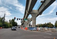Sound Transit Has a Plan to Deliver 130th Street Station in 2025, but Will the Board Fund It? Elevated light rail with pylons next to a street in Northgate.
