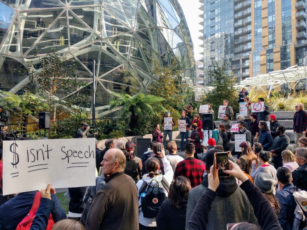 About a 100 people rallied against Amazon for trying to buy the Seattle City Council elections. (Photo by Doug Trumm)