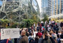 Amazon Tries to Buy Seattle Election with $1.5 Million Donation, Facebook and Google Each Pledge $1 Billion for Housing About a 100 people rallied against Amazon for trying to buy the Seattle City Council elections. (Photo by Doug Trumm)