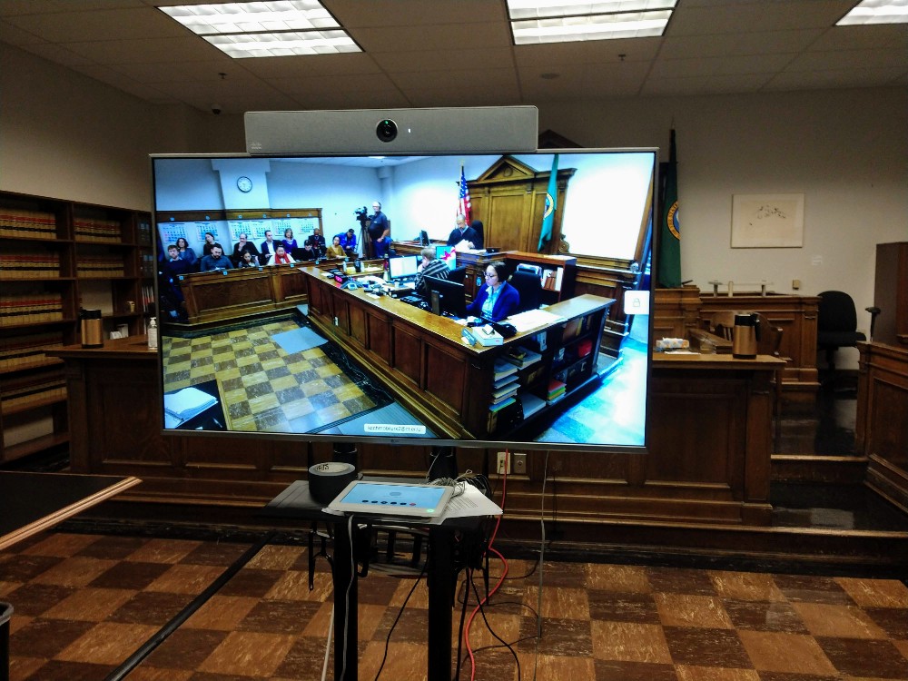 The injunction hearing was heavily attended and the King County Courthouse added an overflow room where people could watch Judge Ferguson and the attorneys discuss the case. After hearing the case, the judge issued his ruling the following morning granting injunction against implementation of the I-976 and staying the cuts to transportation agencies. (Photo by author)