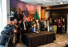 JumpStart Seattle Passes 7-2–Will Mayor Durkan Sign It or Force Veto Override? Mayor Jenny Durkan signs the Fare Share Plan into law at city hall. (Photo by Doug Trumm)