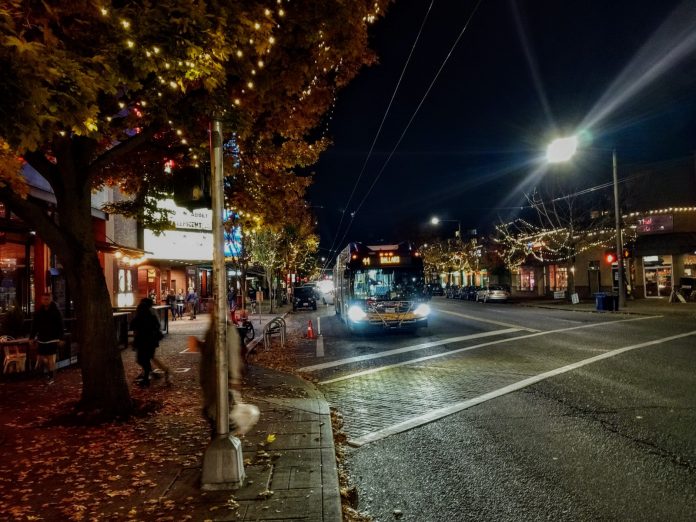 Route 44 heads through downtown Ballard on Market Street on a fall evening. (Photo by Doug Trumm))
