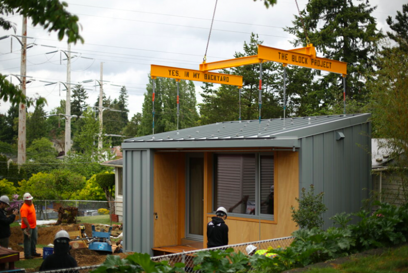 Volunteers work to install a BLOCK Project tiny house in Rainier Valley. (Credit: BLOCK Project)