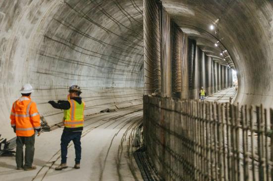 Workers in the tunnel under downtown Bellevue, which stretches from East Main Station to Bellevue Downtown Station. (Sound Transit)
