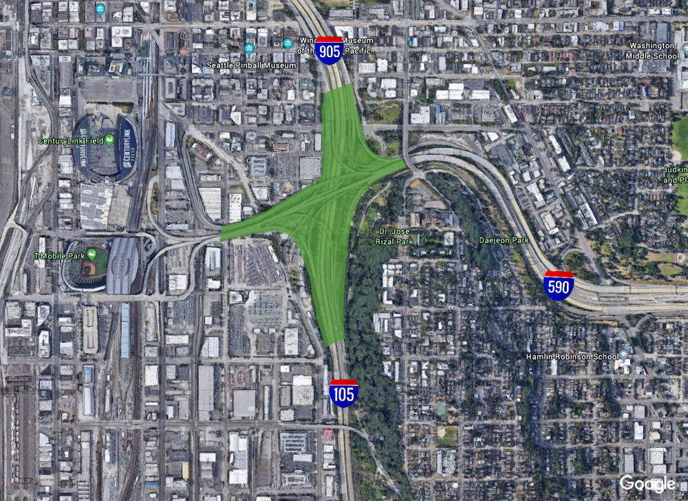 The downtown intersection of major highways occupies almost 65 acres of land. This is the equivalent of 50 football fields. Using urban space as throughways destroys neighborhoods and hogs land. Revising the highway numbers as shown would allow this intersection to be redesigned and returned to productive use. (Google Earth with revisions by Ray Dubicki)