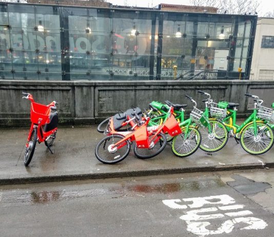 Lime Trims Staff and Bikeshare Fleet but Says It’s Not Closing Up Shop… Yet A bikeshare pile up where bikes accumulated outside the Sounder Station in Pioneer Square. (Photo by Doug Trumm)