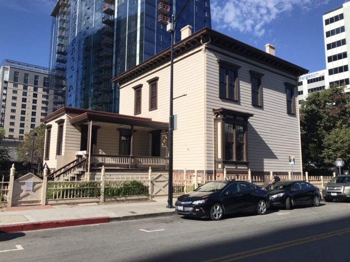 Historic Thomas Fallon House juxtaposed by new highrise San Jose.