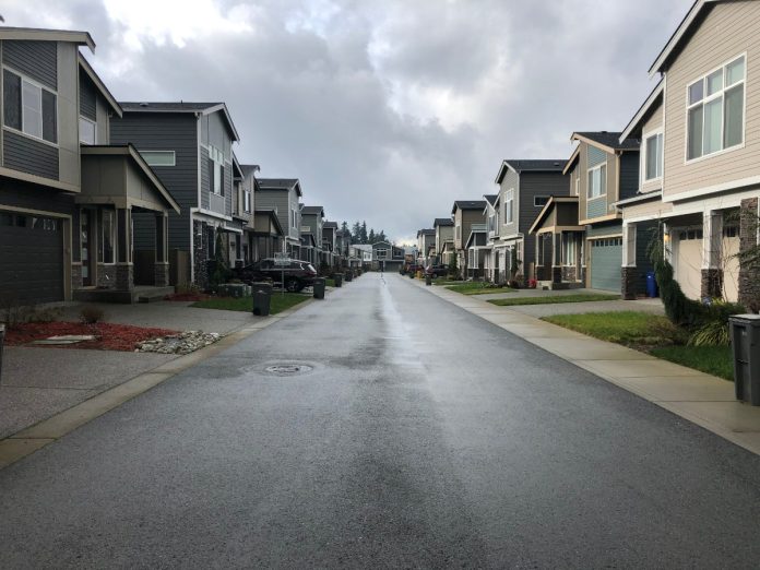 Suburban street Snohomish County suburban sprawl. A view of 192 Place SE located within the unincorporated Bothell urban growth area. This is one of many private streets in this development, a mechanism that allows for the construction and upkeep of the road to be placed on homeowners associations instead of a municipality. (Photo by Ray Dubicki)